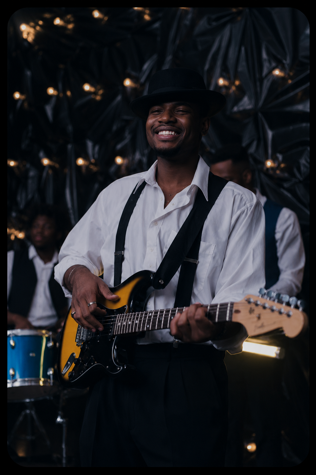 Smiling Guitarist Under Warm Stage Lights